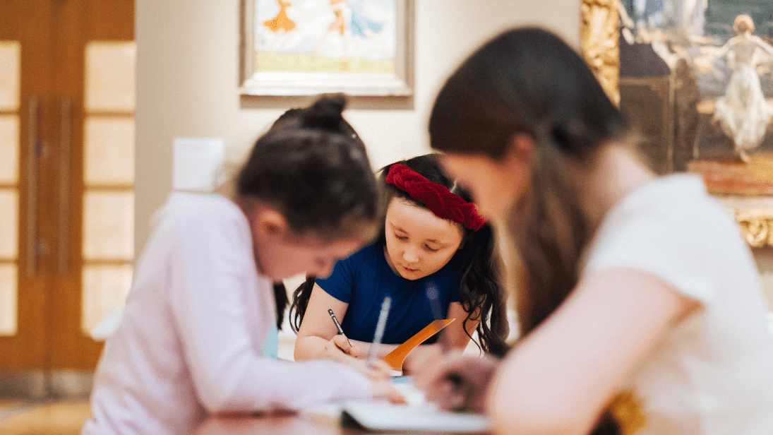 four girls drawing pictures in Ulster Museum art galleries