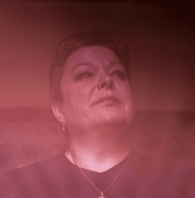 Photograph Portrait of Dawn Purvis, wash of red over the image
