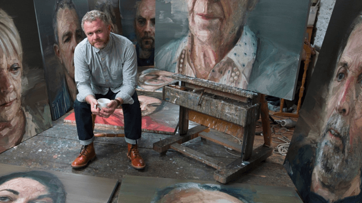 Colin Davidson in his studio with the Silent Testimony portraits