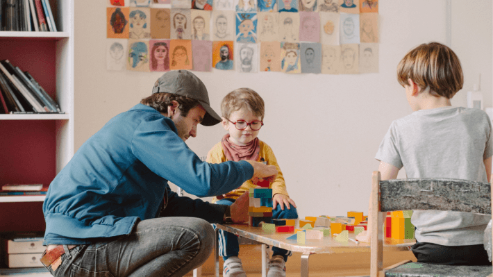 A boy and man playing in discover art